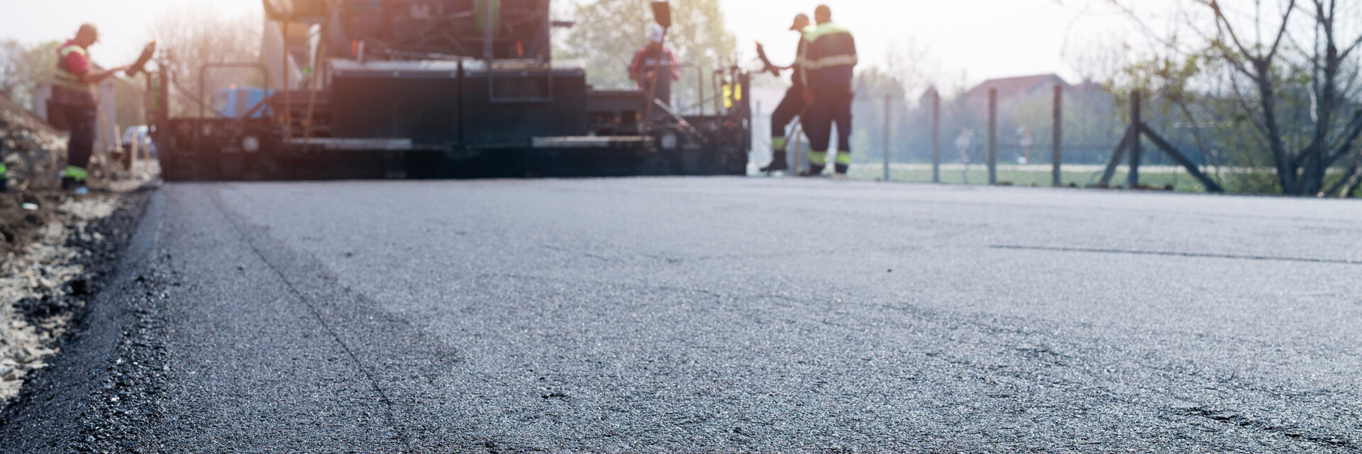 /uploads/media/hero_small_desktop_slide/00/2580-workers-placing-new-coating-of-asphalt-on-the-road.jpg?v=1-0